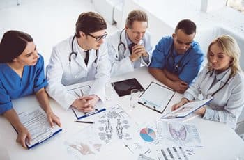 Successful medical doctors are discussing diagnosis during the conference